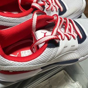 Selling mens pumas sneakers in good condition has a slight stain on the material